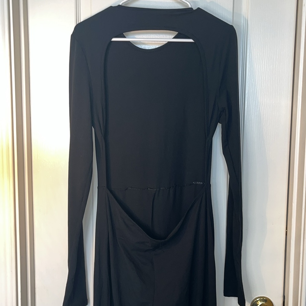 Black cut out back body suit. Flared leg soft feel. Figure hugging. Large.